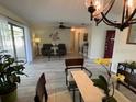 Bright living room with ceiling fan, stylish decor, and lots of natural light at 3131 Lowndes Dr, Winter Park, FL 32792