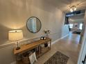 Beautiful entryway featuring a console table, decorative mirror, and neutral decor at 3399 Buoy Cir, Winter Garden, FL 34787