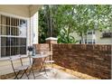 Cozy patio with brick wall, perfect for outdoor relaxation at 5005 Laguna Bay Cir # 17, Kissimmee, FL 34746