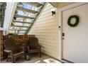 Inviting porch with seating and wreath, enhancing curb appeal at 5005 Laguna Bay Cir # 17, Kissimmee, FL 34746