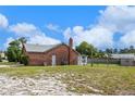 A spacious backyard featuring a well-maintained lawn and full fence at 549 Mcneal Dr, Deltona, FL 32725