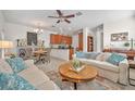 Open-concept living area with dining space and comfortable furnishings at 58 Zamora Pl, Oviedo, FL 32765