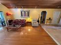 Spacious living room featuring hardwood floors and comfortable seating, perfect for relaxing and entertaining at 913 Red Fox Rd, Altamonte Springs, FL 32714