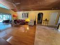 Bright living room boasts vaulted wood ceilings, hardwood floors, and ample natural light from the adjacent patio at 913 Red Fox Rd, Altamonte Springs, FL 32714
