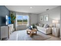Comfortable living room with a large window offering a view of the outdoors at 1301 June Lake, Lake Hamilton, FL 33851