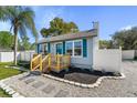 Inviting home exterior with a cozy porch and neatly landscaped front yard at 1900 E Orange Ave, Eustis, FL 32726