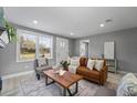 Bright living room with a comfortable seating arrangement and natural light at 1900 E Orange Ave, Eustis, FL 32726