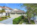 Charming single-story home featuring a two-car garage and well-maintained landscaping and lawn at 211 Southbridge Cir, Kissimmee, FL 34744