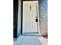 White front door with black hardware provides secure entry to the home at 238 Riverbend Dr # 105, Altamonte Springs, FL 32714