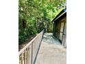 A relaxing outdoor patio area with a railing, perfect for enjoying the serene surroundings at 238 Riverbend Dr # 105, Altamonte Springs, FL 32714
