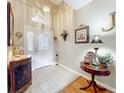 Inviting foyer with tile flooring and decorative accents at 2409 Twickingham Ct, Clermont, FL 34711