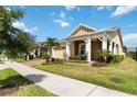 Beautiful home exterior featuring a manicured lawn, well-placed landscaping, and a brick-paved driveway at 2789 Southland St, St Cloud, FL 34772