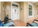 Inviting entryway with decorated door and cozy seating area at 2808 Osprey Cove Pl # 201, Kissimmee, FL 34746