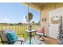 Relaxing screened patio with outdoor seating and scenic views at 2808 Osprey Cove Pl # 201, Kissimmee, FL 34746