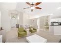 Bright living room featuring vaulted ceilings, an open layout, and stylish modern furnishings at 2884 Picadilly Cir, Kissimmee, FL 34747