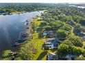 A beautiful waterfront property with a private dock, a pool and lush green lawns at 2926 Marquesas Ct, Windermere, FL 34786