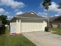 Charming single-story home with well-maintained lawn, and two car garage at 314 Casterton Cir, Davenport, FL 33897