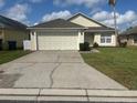 Charming single-story home with well-maintained lawn, and two car garage at 314 Casterton Cir, Davenport, FL 33897