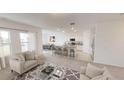 Bright and airy living room flows into a modern kitchen with island seating at 3343 Twilight Rd, Winter Haven, FL 33881