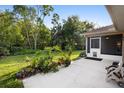 Expansive backyard with mature trees and lush landscaping, creating a private and serene outdoor space at 453 Kettering Rd, Deltona, FL 32725