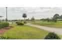 Scenic view of the lush green golf course, perfect for avid golfers to enjoy at 5999 Lake Pointe Dr # 602, Orlando, FL 32822