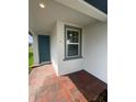Close up of the front door with a window showing a glimpse of the interior, inviting you to step inside at 6028 Bimini Ave, Haines City, FL 33844