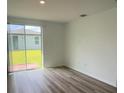 Bright living area with sliding glass doors, offering a seamless transition to the outdoor space at 6028 Bimini Ave, Haines City, FL 33844