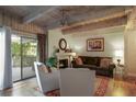 Living room featuring a fireplace, wood floors, and access to the patio at 102 Fairway Dr # 102, Longwood, FL 32779