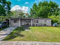 Well-maintained single-story home with a cozy front porch and mature landscaping creating great curb appeal at 106 Alhambra Ave, Altamonte Springs, FL 32714