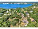 Stunning aerial view showing proximity to the gorgeous lake and surrounding mature trees at 12030 Kirby Smith Rd, Orlando, FL 32832