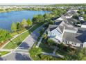 Beautiful aerial view of home in lakeside community, showcasing proximity to water at 13618 Briand Ave, Orlando, FL 32827