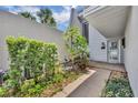 Charming entrance featuring lush landscaping and stylish decor at 264 Balfour Dr, Winter Park, FL 32792