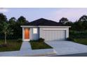 Charming single-story home with a two-car garage and well-manicured lawn at 2791 San Marco Way, Winter Haven, FL 33884