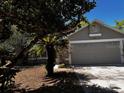 Charming home featuring mature landscaping and a two-car garage at 3144 Ginger Cir, Orlando, FL 32826