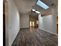 Bright living room featuring high ceilings, tile floors and skylights at 3144 Ginger Cir, Orlando, FL 32826