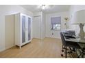 Bright bedroom with laminate flooring, featuring a closet and natural light from the window at 4025 Luan Dr, Orlando, FL 32808