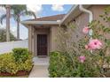 Inviting front entrance with a stylish door, manicured landscaping, and a 'Welcome' doormat at 427 Highland Meadows St, Davenport, FL 33837
