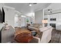 Inviting living room with comfortable seating, hardwood floors, and an open view to the kitchen at 501 Mirasol Cir # 519, Celebration, FL 34747