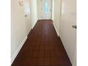 Hallway features a tiled floor, white doors, and neutral paint, with a front door at the end of the hall at 532 Madison Ave, Orlando, FL 32805