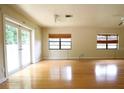 Bright living room with hardwood floors, natural light, and a ceiling fan at 532 Madison Ave, Orlando, FL 32805