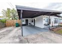 Attached carport offering covered parking and a convenient entrance to the home at 620 E Church Ave, Longwood, FL 32750