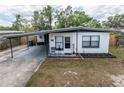 Charming single-story home with a carport and freshly painted exterior at 620 E Church Ave, Longwood, FL 32750