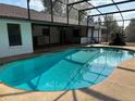 Inviting screened-in pool with a spacious deck, perfect for outdoor entertaining and relaxation at 9538 Lavill Ct, Windermere, FL 34786