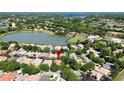 Aerial view shows the house nestled within a community with lake views at 1210 Pallister Ln, Lake Mary, FL 32746