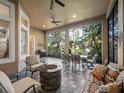 Inviting covered patio featuring a fire pit and outdoor seating at 1210 Pallister Ln, Lake Mary, FL 32746