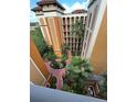 Elevated view of complex courtyard showing lush landscaping and multi-story building architecture at 12539 Floridays Resort Dr 411 # 411D, Orlando, FL 32821