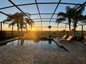 Beautiful enclosed pool area with comfortable lounge chairs that overlook the breathtaking sunset views at 5004 Hartwell Ct, St Cloud, FL 34771