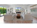 Cozy living room with fireplace, modern TV, and comfortable sofas facing a fireplace at 10254 Beechwood Ln, Orlando, FL 32832
