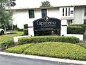 Welcoming Capistrano Condominiums community sign with manicured landscaping and attractive building facade at 200 Maitland Ave # 87, Altamonte Springs, FL 32701