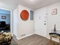Bright hallway with wood-look floors, neutral paint, and stylish decor that makes a warm welcome at 200 Maitland Ave # 87, Altamonte Springs, FL 32701